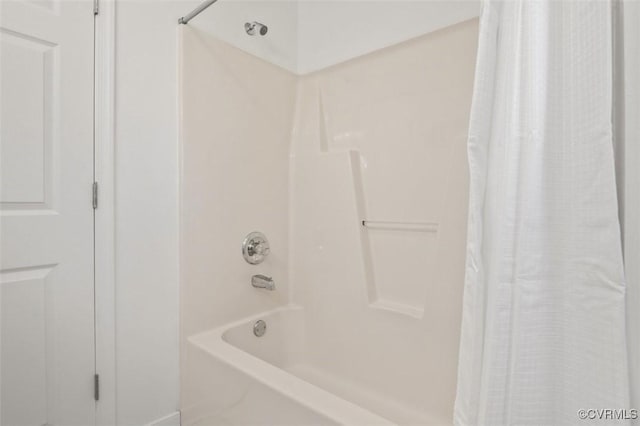 bathroom with shower / bath combination with curtain