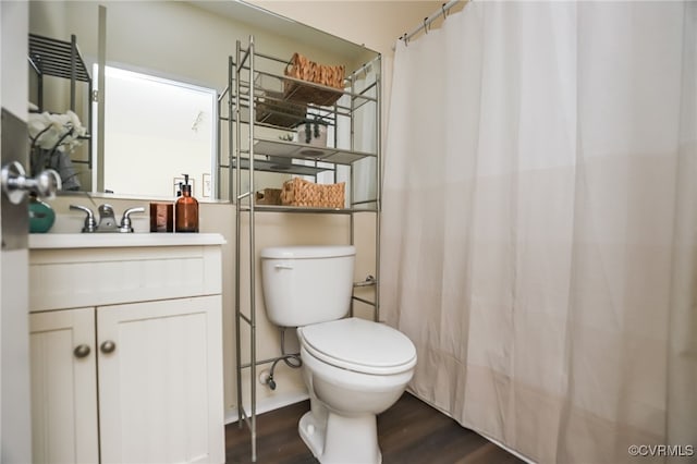 bathroom featuring hardwood / wood-style flooring, vanity, and toilet