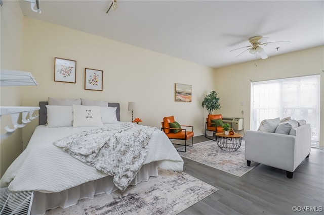 bedroom featuring dark hardwood / wood-style floors and ceiling fan