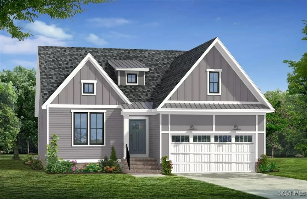 view of front of house with a garage and a front yard