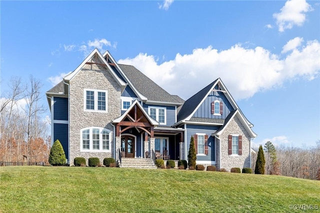 view of front of home featuring a front yard and a porch