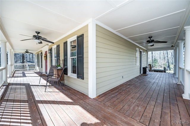 wooden terrace featuring ceiling fan and a porch