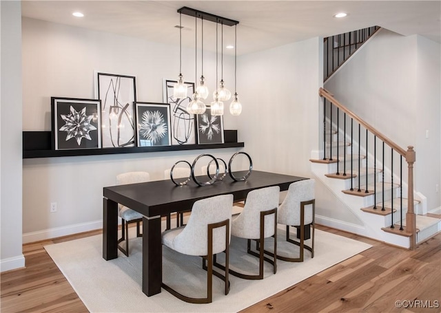 dining room with wood-type flooring