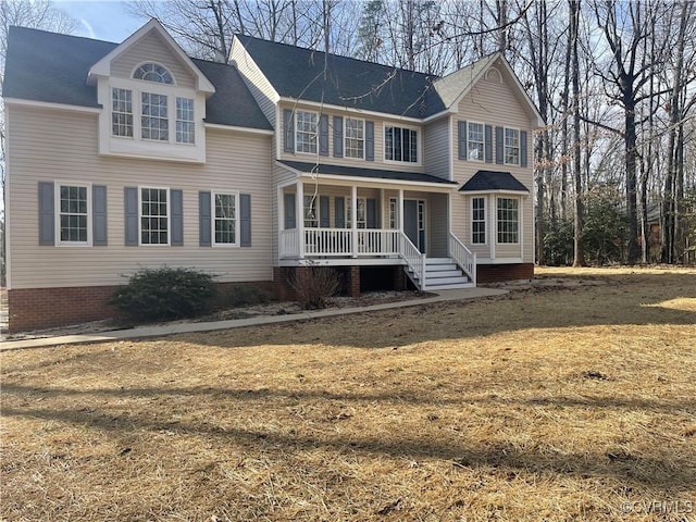 view of front property featuring a front yard and a porch