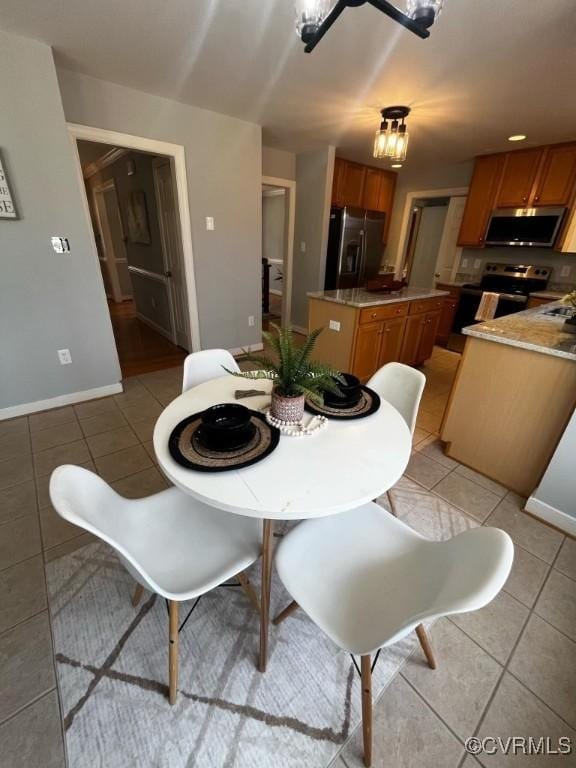 dining area with light tile patterned flooring