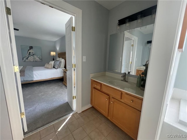 bathroom with tile patterned flooring and vanity