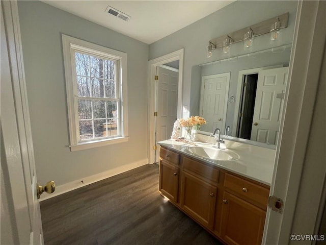 bathroom featuring vanity and hardwood / wood-style flooring