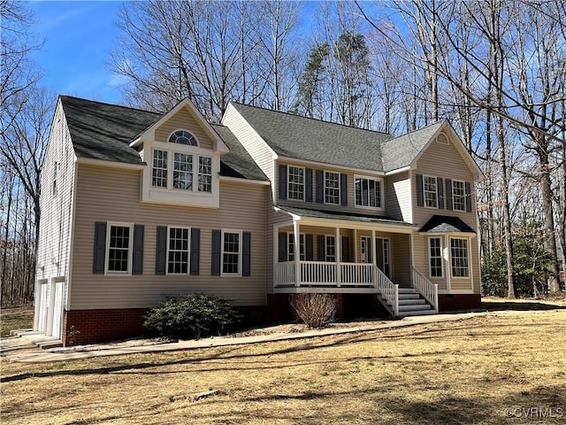 view of front of property with a shingled roof and a porch