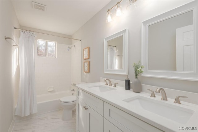 full bathroom with vanity, shower / tub combo, and toilet