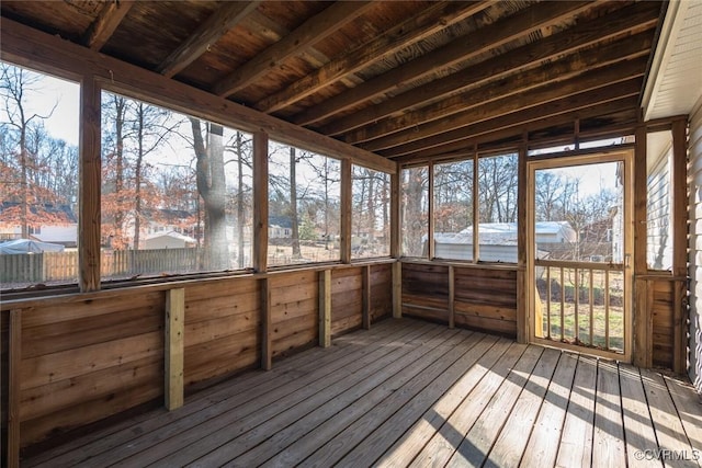 unfurnished sunroom featuring wood ceiling