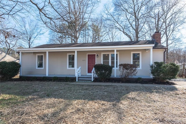 view of front of house featuring a front yard and covered porch