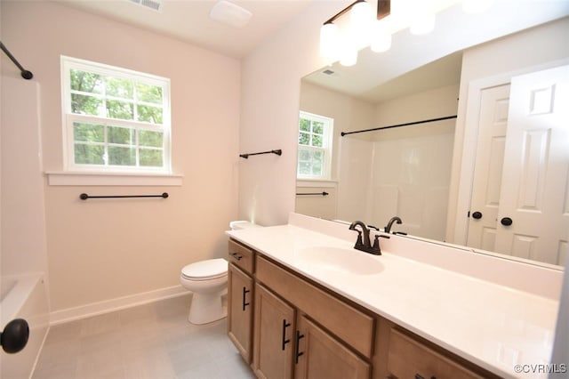 full bathroom featuring shower / tub combination, vanity, toilet, tile patterned floors, and baseboards