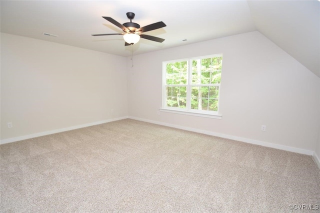 interior space with baseboards, ceiling fan, and carpet