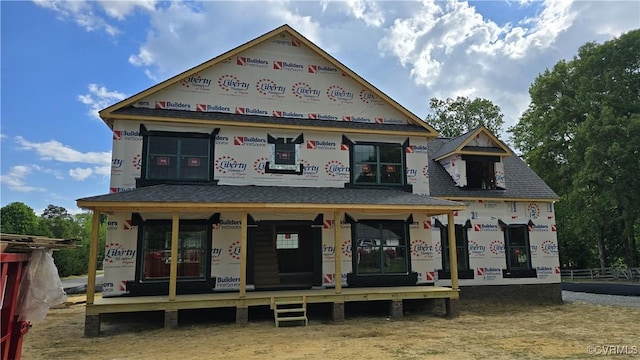 property under construction with a shingled roof