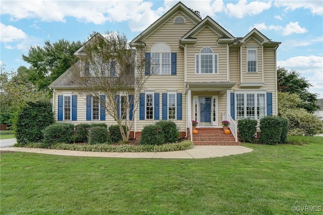 view of front facade featuring a front yard