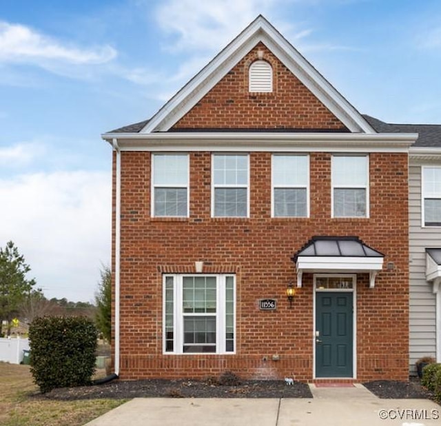 view of front of home with brick siding