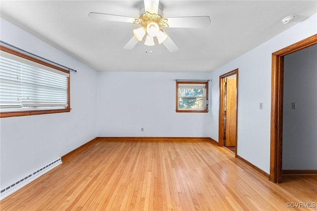 unfurnished room with a baseboard radiator, ceiling fan, and light hardwood / wood-style flooring