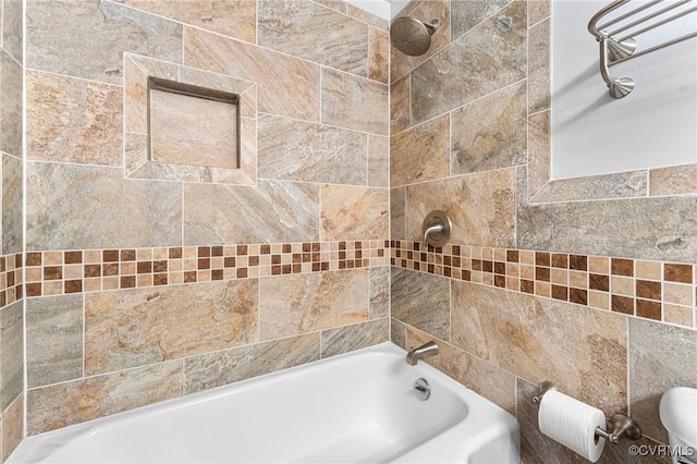 bathroom featuring tiled shower / bath combo