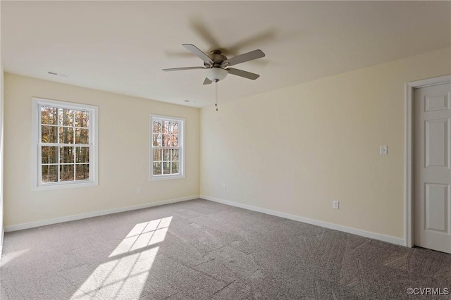 unfurnished room with light carpet and ceiling fan