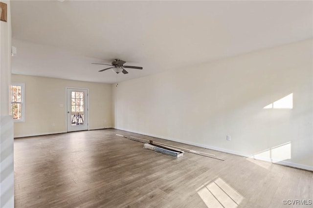 spare room with wood-type flooring and ceiling fan