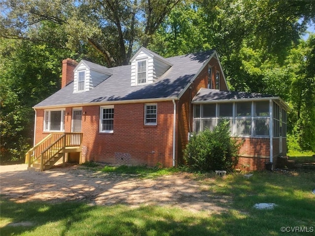 back of property featuring a sunroom