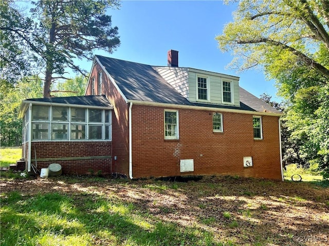 rear view of house with a sunroom