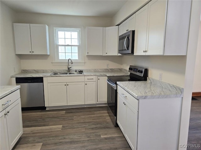 kitchen featuring white cabinetry, sink, and appliances with stainless steel finishes