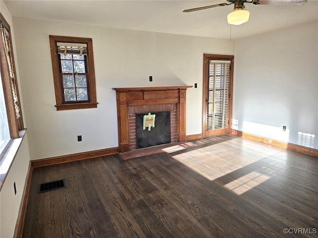 unfurnished living room with ceiling fan, a fireplace, and hardwood / wood-style floors