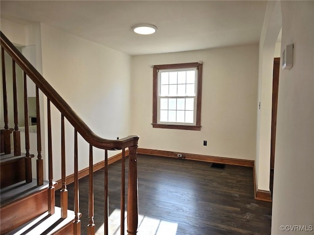 stairs featuring hardwood / wood-style flooring