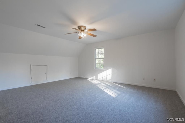 bonus room with vaulted ceiling, ceiling fan, and carpet flooring