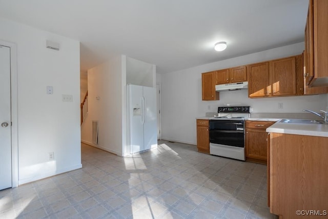 kitchen featuring white appliances and sink