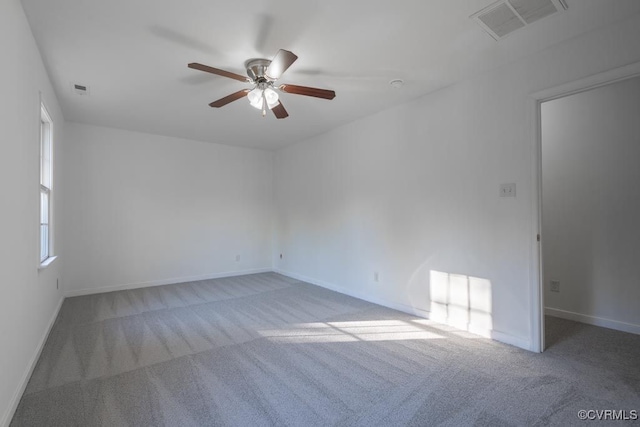 empty room with light carpet and ceiling fan