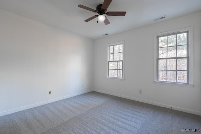 spare room with ceiling fan and carpet flooring