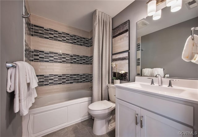 full bathroom featuring vanity, toilet, and shower / tub combo with curtain