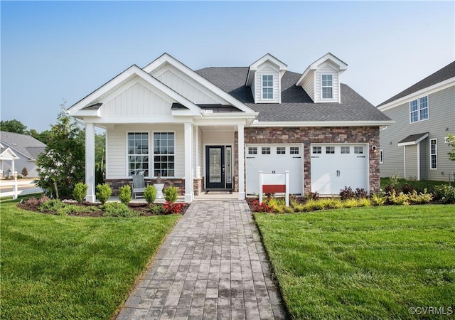 view of front of house featuring a garage and a front yard