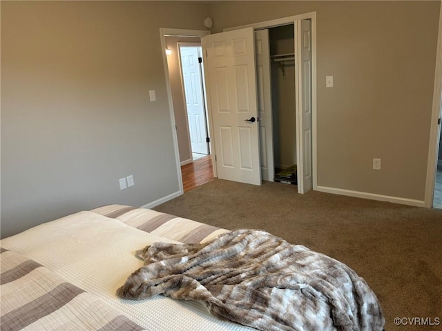 carpeted bedroom with a closet