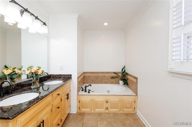 bathroom featuring ornamental molding, vanity, a bathtub, and tile patterned floors