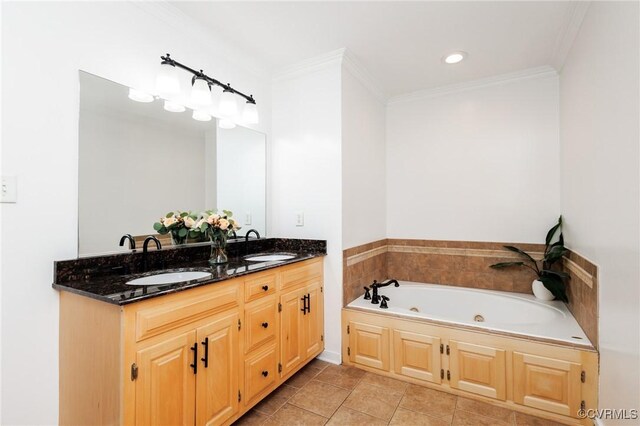 bathroom with vanity, tile patterned flooring, ornamental molding, and a tub