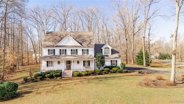 view of front of home featuring covered porch and a front lawn