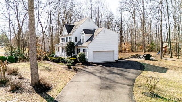 view of side of home with a garage