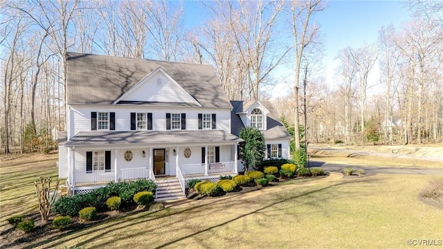 view of front of home featuring a front yard and a porch