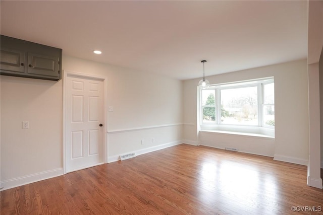 unfurnished dining area with hardwood / wood-style flooring