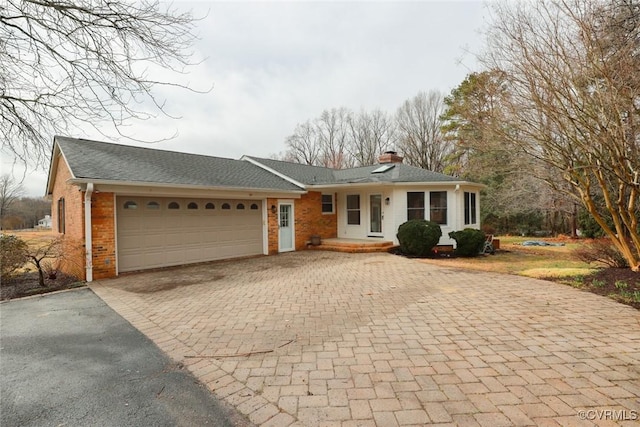 ranch-style home featuring a garage