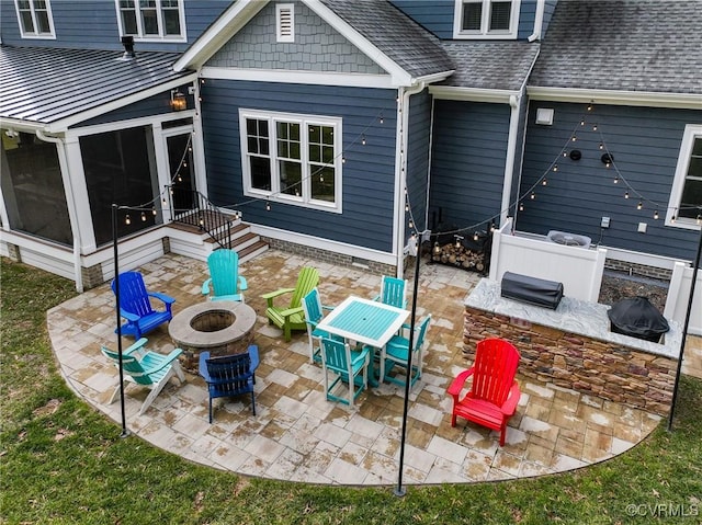 view of patio with an outdoor fire pit