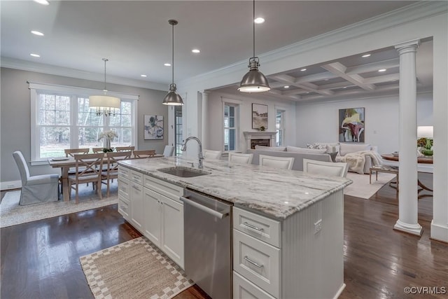 kitchen featuring pendant lighting, dishwasher, white cabinets, coffered ceiling, and a kitchen island with sink