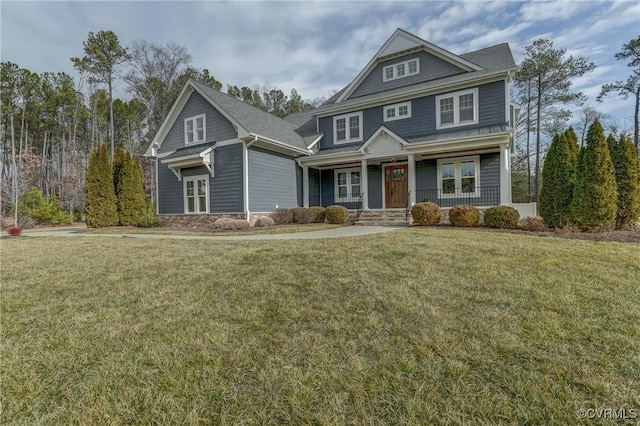 craftsman-style house featuring a porch and a front yard