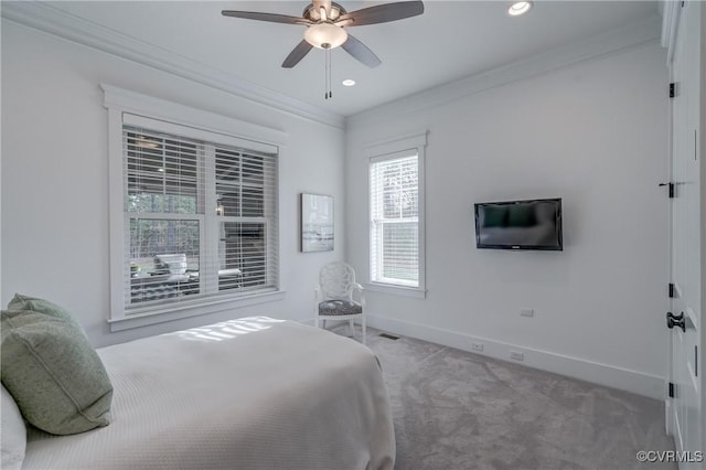 bedroom featuring ornamental molding, carpet flooring, and ceiling fan