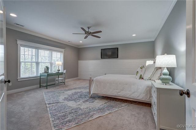 carpeted bedroom featuring crown molding and ceiling fan