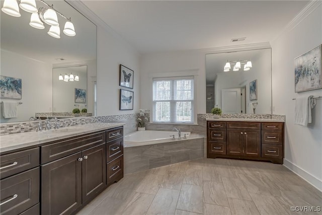 bathroom featuring vanity, ornamental molding, and a relaxing tiled tub