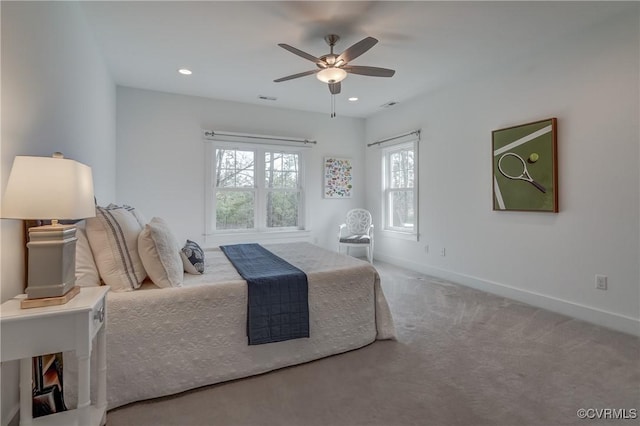 bedroom featuring ceiling fan and carpet